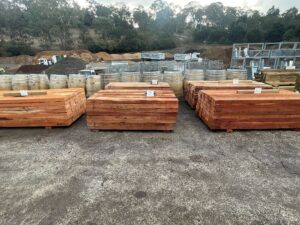 Transform Your Garden with Red Gum Sleepers: Durable, Stylish & Available at Aumann’s 